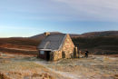 07-4711 Mountain Bikers Take a Break at Ryvoan Bothy Cairngorms Scotland